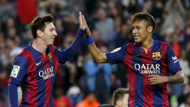 Lionel Messi (left) and Neymar celebrate a goal.