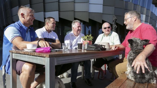 The Gentlemen of Docklands group meet each morning for coffee at the Mad Duck Cafe. From left to right. Shaun Bassett, Matthew Selleck, Trevor Rowe, Ian Johnson and Kim Rea. 