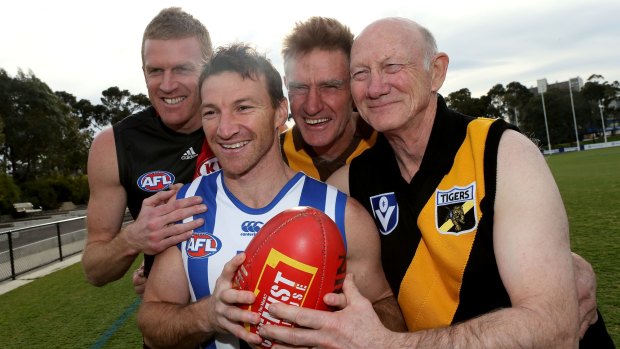North Melbourne footballer Brent Harvey poses for a photo with '400 Club' members Dustin Fletcher, Michael Tuck and Kevin Bartlett.