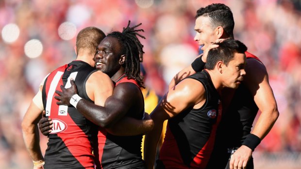 David Zaharakis, Anthony McDonald-Tipungwuti, Mathew Stokes and Ryan Crowley of the Bombers enjoy their victory over Melbourne.