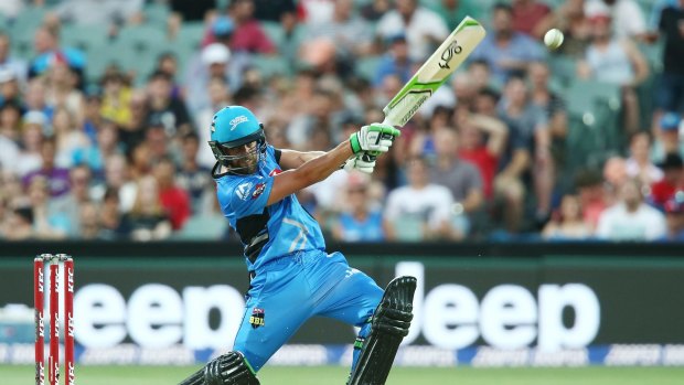 Alex Ross of the Adelaide Strikers slogs a delivery to the boundary during his innings of 65 against the Melbourne Stars.