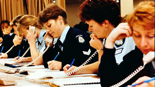 Policewomen take calls during a special phone-in on sexual assault in 1993.