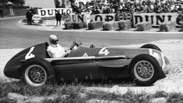 Juan Manuel Fangio comes out of a bend at speed in July, 1951.