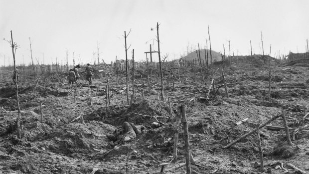 Stretcher bearers of the 57th Battalion, passing through the cemetery near the mound in Polygon Wood in the Ypres Sector.