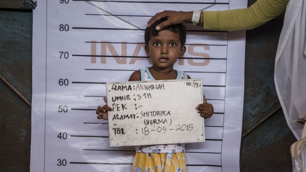 Three-year-old Anwarsah, a Rohingya child, poses for an identification photo at a temporary shelter in Aceh province, Indonesia, last year. 