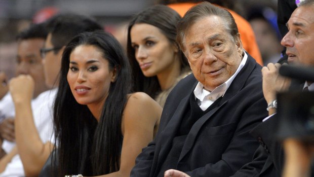 Outrage: Los Angeles Clippers owner Donald Sterling (right) with girlfriend V. Stiviano (left).