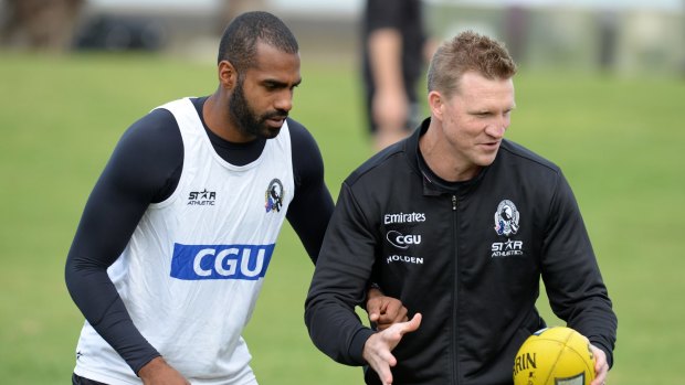 Heritier Lumumba with Nathan Buckley at a Collingwood training session in 2014.