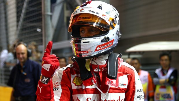 Sebastian Vettel celebrates his pole victory.