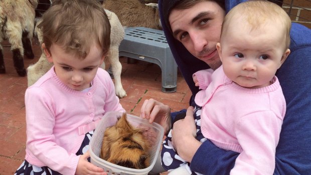 Callum Hall, who died after trying to save his friend last week, with daughters Valerie, 3, and Lilliana, one.