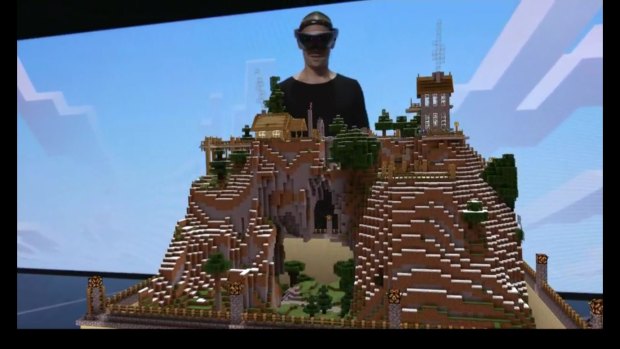 A representative from Minecraft developer Mojang shows off the HoloLens version of the game during E3.