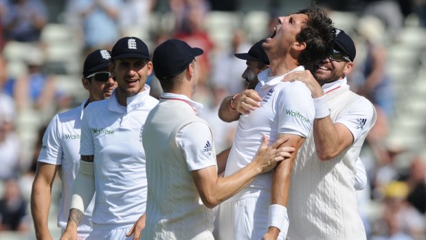 England's Steven Finn celebrates after taking the wicket of Pakistan captain Misbah-ul-Haq.