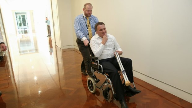 Mr Briggs, pictured the day after Tony Abbott lost the prime ministership, injured his knee at a party hosted by the former leader on the night he was dumped as PM.