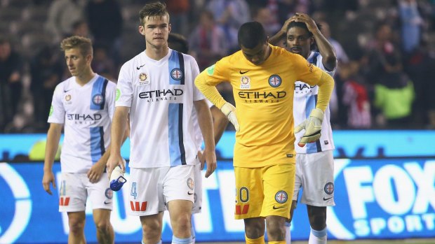 Sad end: Melbourne City players leave the ground after they were defeated by the Victory on Friday.