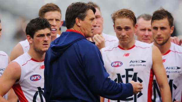 Finals chances over: Demons coach Paul Roos speaks to his players.