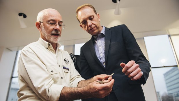 Reptile attraction: Murray Evans and Simon Corbell with two legless lizards. 
