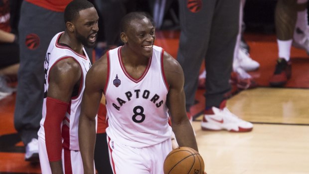 Toronto Raptors Bismack Biyombo and Patrick Patterson share a smile during the match.
