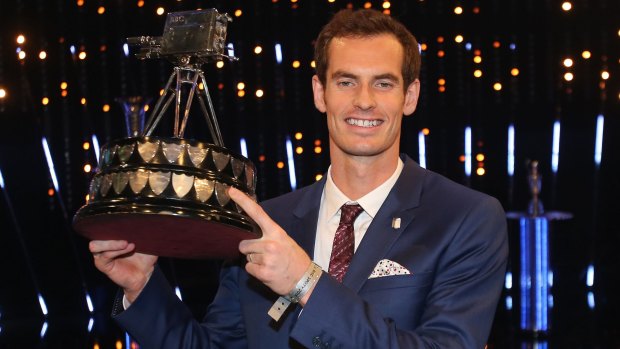 Andy Murray poses with the trophy.
