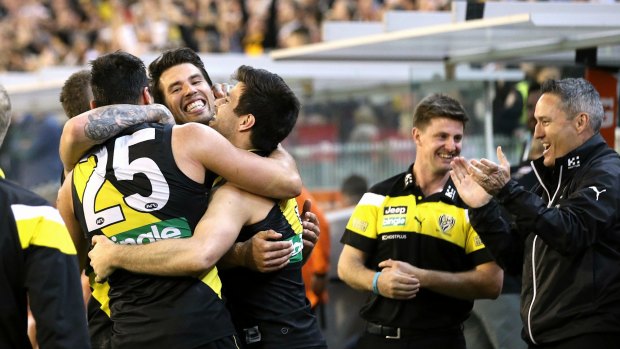 I'm back: The Tigers celebrate making it to the grand final.