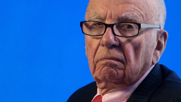 The real thing: The unmistakable Rupert Murdoch - but who is the doppelganger spotted in his limo in Sydney?