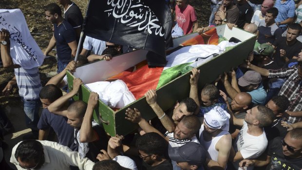 Palestinians carry the body of 16-year-old Mohammed Abu Khudair at his funeral in July 2014.