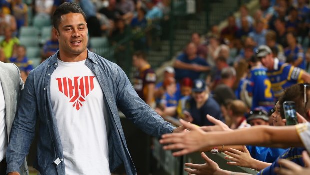 Back in blue and gold? Jarryd Hayne high fives the crowd at Pirtek Stadium earlier this season.