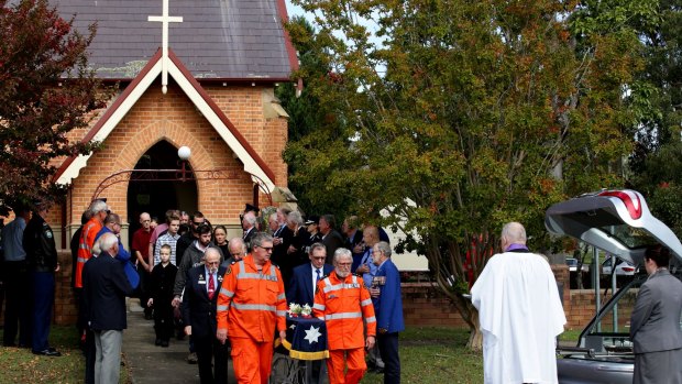 Mourners attend the funeral of Brian Wilson, who died in the Dungog floods.