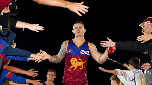 Main man: Lions captain Dayne Beams leads his team off after round 12 win over the Dockers.