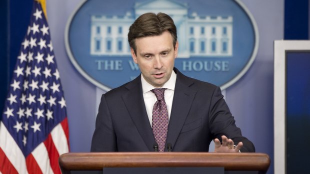 Hard questions: White House press secretary Josh Earnest does his best to insulate Mr Obama from the Senate report's fallout on Thursday.