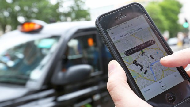 A user scans for an available vehicle using the Uber app. Taxi drivers in London and Paris have protested against the online ridesharing startup threatening their livelihood.