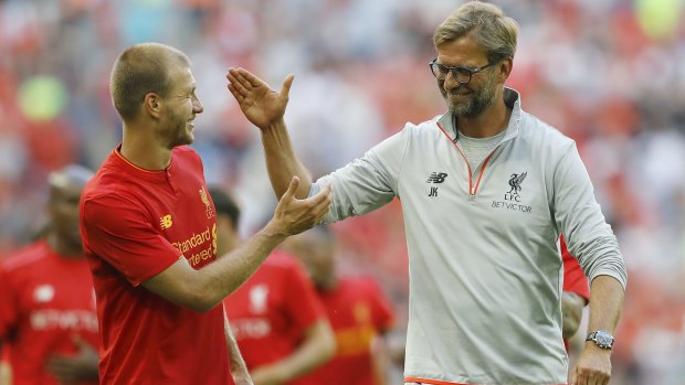 Juergen Klopp, right and Ragnar Klavan look happy after they won the International Champions Cup game against Barcelona. 