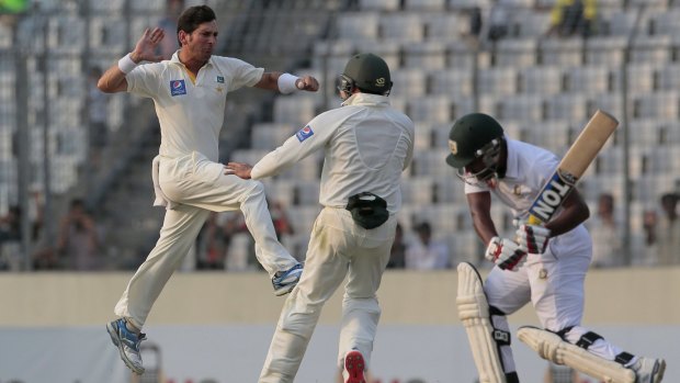 Pakistan's Yasir Shah celebrates after dismissing Bangladesh's Imrul Kayes on the third day of the third and final Test.
