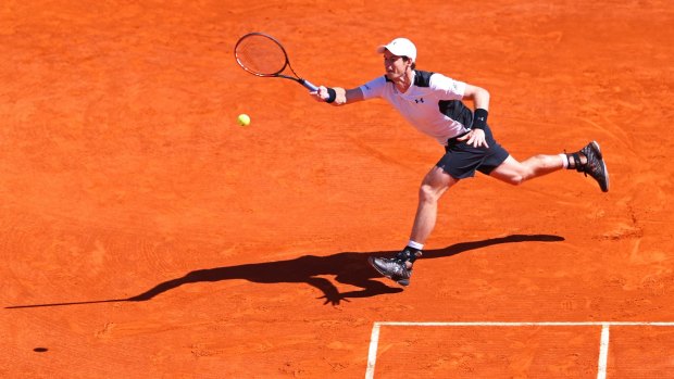Andy Murray stretches to hit a forehand.