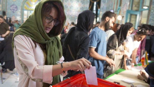 Iranians began voting Friday in the country's first presidential election since its nuclear deal with world powers.