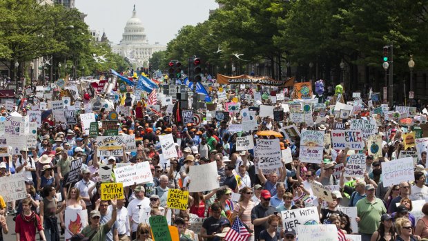 Demonstrators march down Pennsylvania Avenue during the People's Climate Movement March in Washington on Saturday.