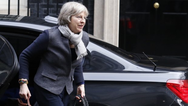 Home Secretary Theresa May arrives for the cabinet meeting at Downing Street on Saturday.