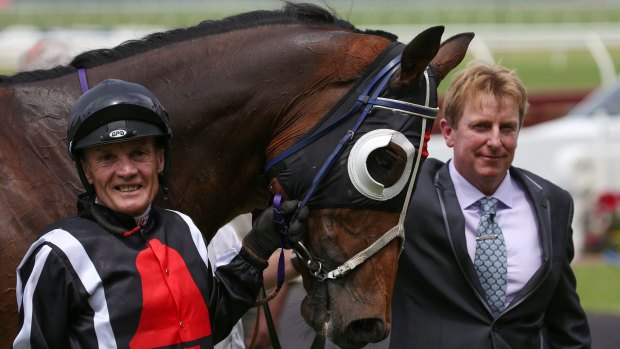 Win for the ages: Kevin Forrester with Jungle Edge and trainer Mick Bell after victory in the Kevin Heffernan Stakes at Sandown. 