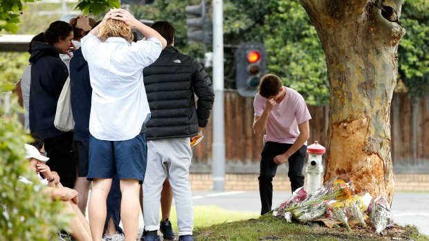 Grieving friends arrive at the scene of the crash.