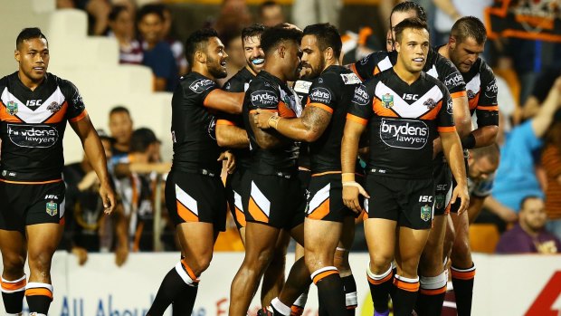 Party time: The Tigers celebrate one of their seven tries.