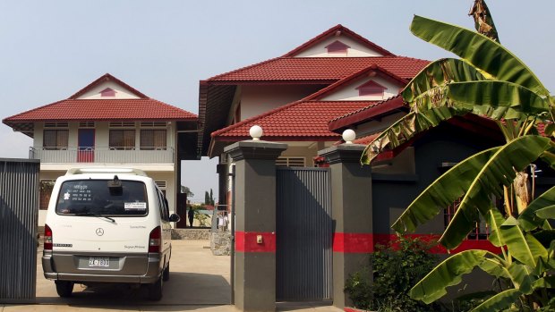 A van enters a residence temporarily housing the first group of asylum seekers in Phnom Penh, Cambodia in June.