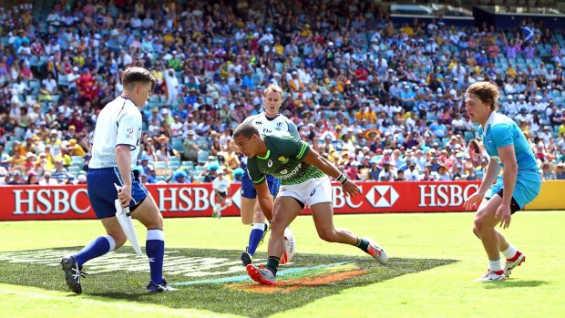 Sea of colour: South Africa's Cheslin Kolbe touches down in front of a huge crowd at Allianz Stadium.