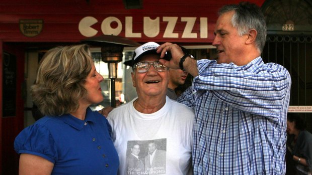 Luigi Coluzzi with Malcolm and Lucy Turnbull outside Bar Coluzzi in Darlinghurst.