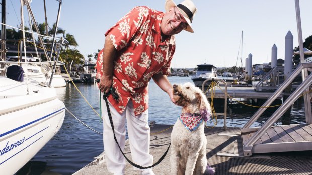 Labor candidate for the seat of Fisher, Bill Gissane, with his dog Jazz, pictured on his private wharf in Buddina. 