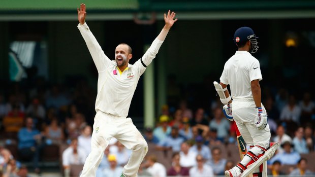 Appealing: Nathan Lyon appeals for the wicket of Wriddhiman Saha.