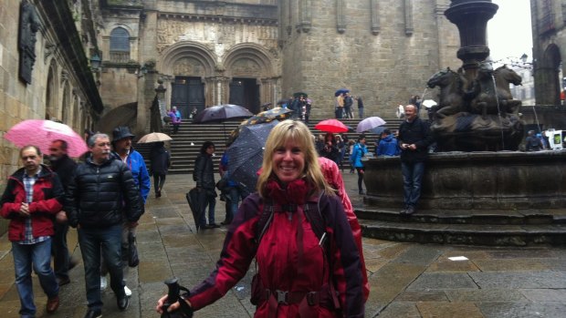 Gayle Bryant outside the cathedral at Santiago on the Camino de Santiago.  