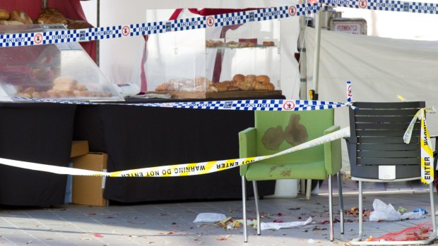 A blood-spattered chair is taped off at the Hornsby crime scene on June 9.