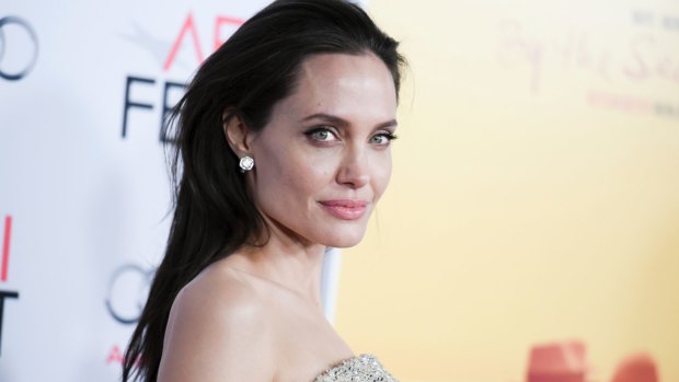 Single life is tough, but Angelina Jolie keeps a brave face in front of the children.