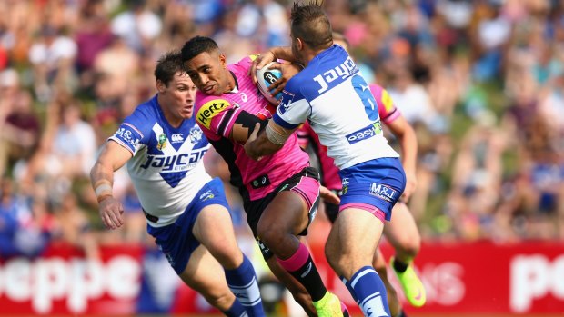 Rookie rising: Panthers winger George Jennings is tackled during the round one NRL match between the Penrith Panthers and the Canterbury Bulldogs at Pepper Stadium on March 8, 2015 in Sydney, Australia.  (Photo by Cameron Spencer/Getty Images)