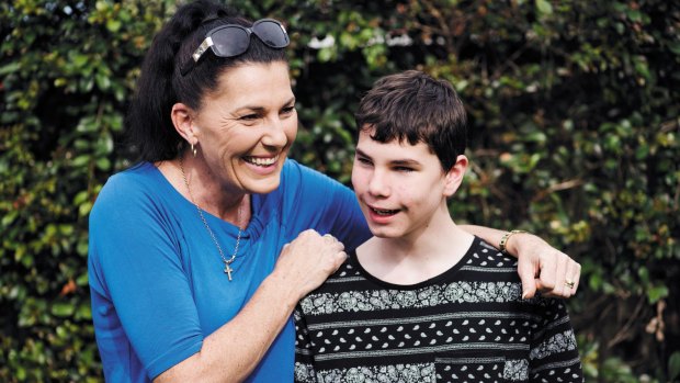 Ally McLeod with her son Connor McLeod, a 15-year-old who was born blind and convinced the Reserve Bank to introduce tactile banknotes. 
