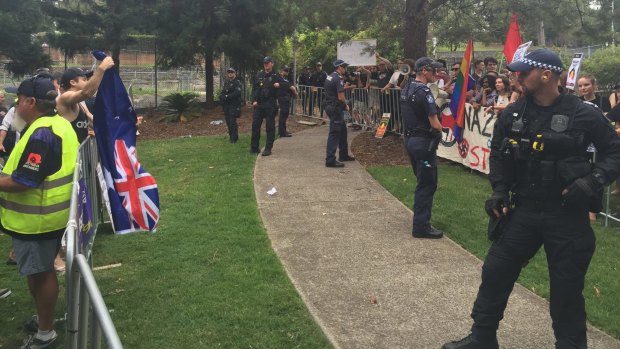 Police stand between the Reclaim Australia rally and counter rally.