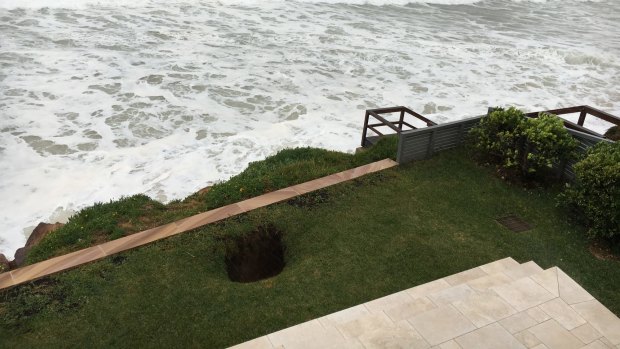 A sinkhole has opened on the lawn in front of Brian Vegh's Collaroy unit.